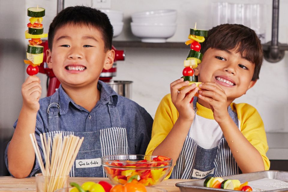 Two kids cooking